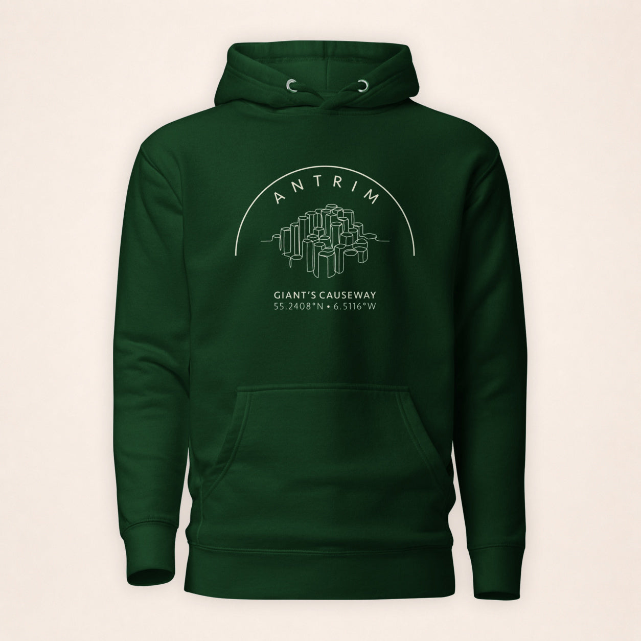 Antrim Giant’s Causeway forest green hoodie on a warm ivory background