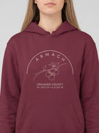 Maroon hoodie with 'Armagh Orchard County' design on a white background