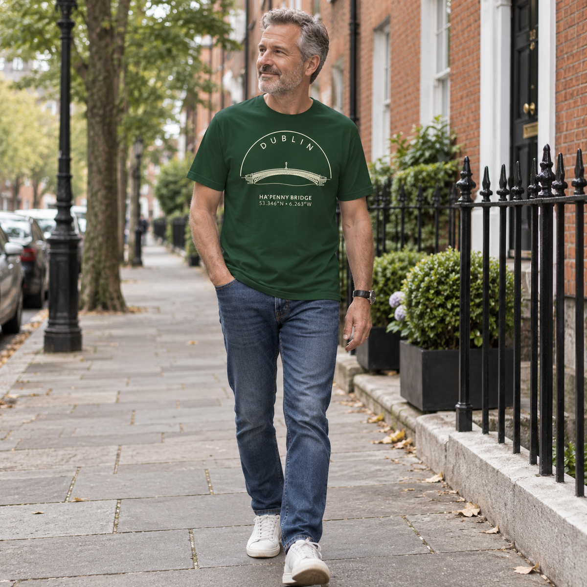 Man wearing Dublin Ha’penny Bridge forest green T-shirt in a local setting