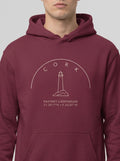 Maroon hoodie with a lighthouse design on a white background