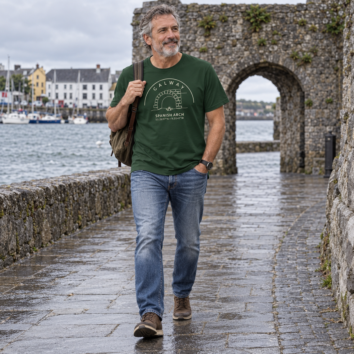 Man wearing Galway Spanish Arch & Claddagh forest green T-shirt