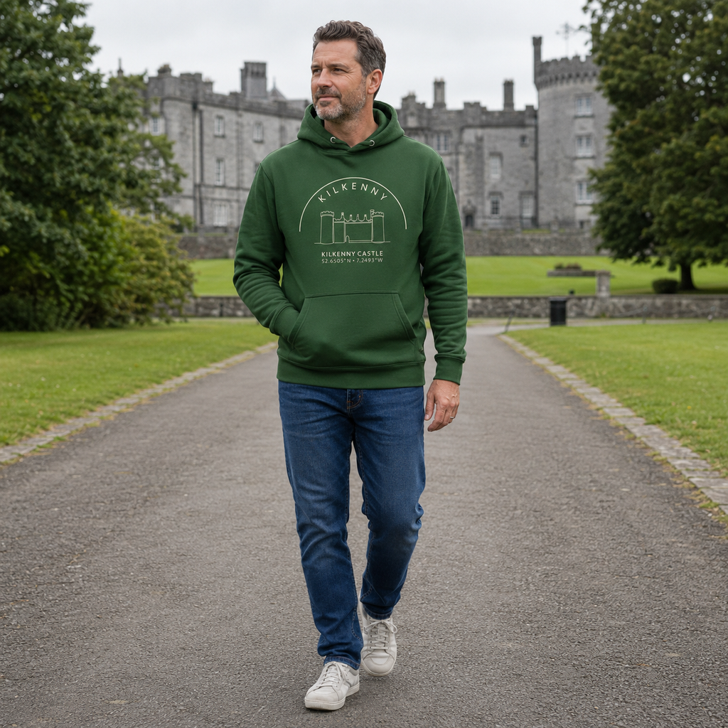 Man wearing the Kilkenny Castle forest green hoodie in the castle grounds