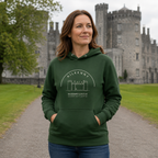 Woman wearing the Kilkenny Castle forest green hoodie in the castle grounds