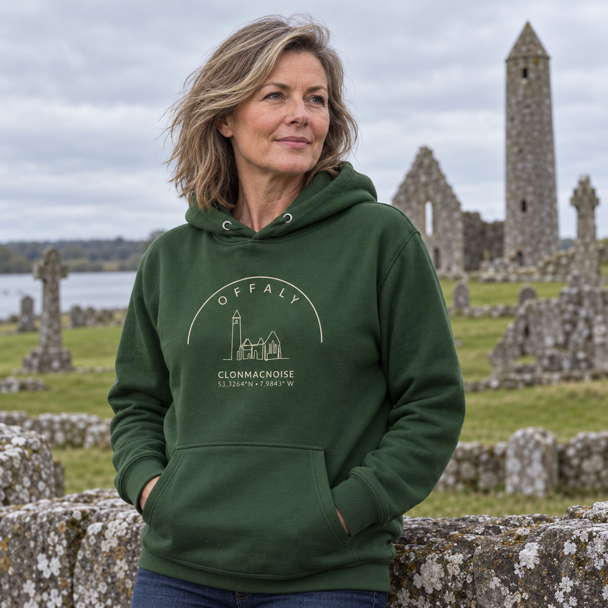 Woman wearing the Offaly Clonmacnoise forest green hoodie at Clonmacnoise