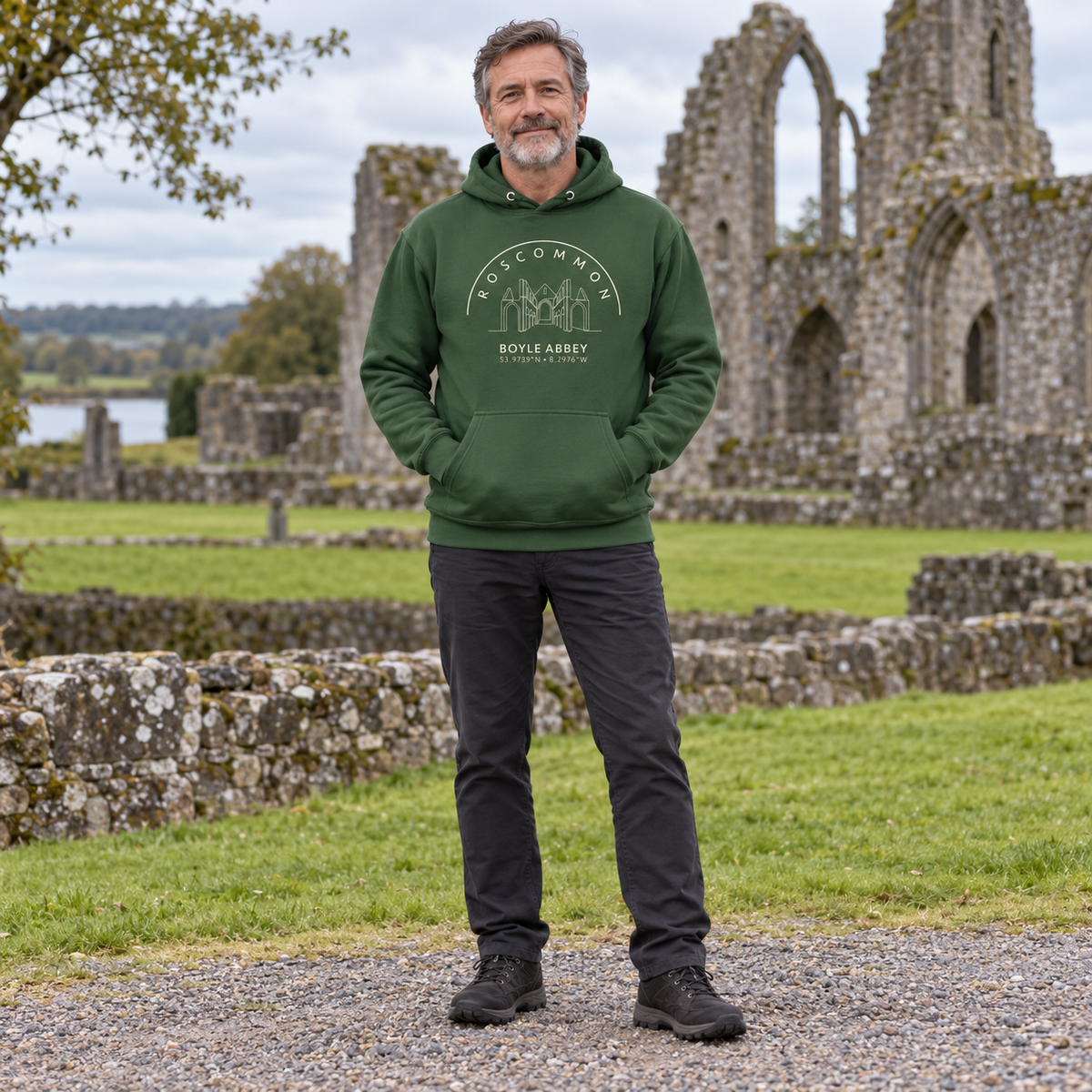 Man wearing the Roscommon Boyle Abbey forest green hoodie at Boyle Abbey